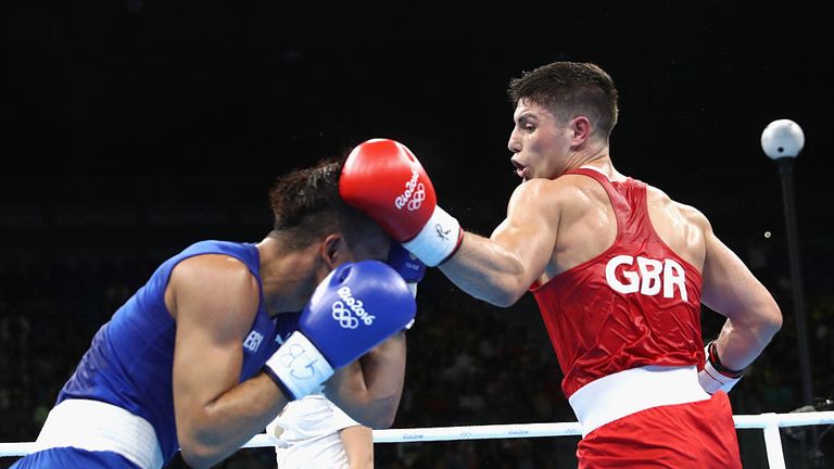 RIO DE JANEIRO, BRAZIL - AUGUST 08:  Josh Kelly of Great Britain (red) fights Walid Mohamed of Egypt (blue) in their Mens 69kg Welterweight