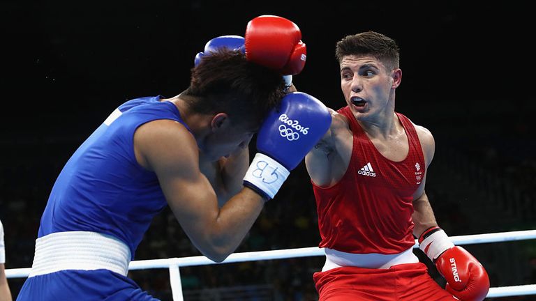  Josh Kelly of Great Britain (red) fights Walid Mohamed of Egypt (blue) in their Mens 69kg Welterweight bout