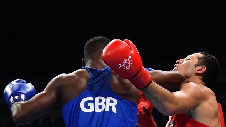 Great Britain's Joshua Buatsi (L) lands a hook on Uzbekistan's Elshod Rasulov during the Men's Light Heavy (81kg) match at the Rio 2016 Olympic Games at th