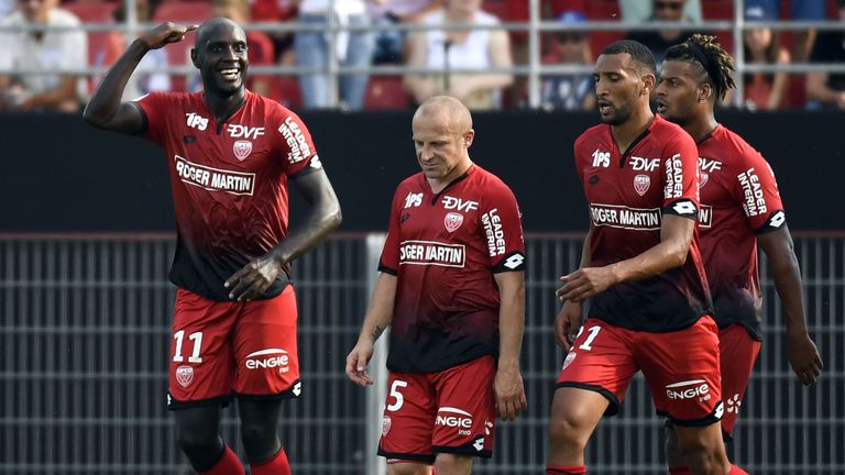 Dijon's Cap Verde forward Julio Tavares (L) reacts with his team-mates