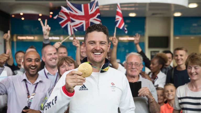  Golfer Justin Rose of Great Britain poses with his Gold Medal after arriving on a British Airways flight from Rio de Janeiro 