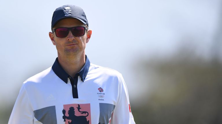 Britain's Justin Rose grimaces after missing a birdie shot in the men's individual stroke play final day at the Olympic Golf course during the Rio 2016 Oly