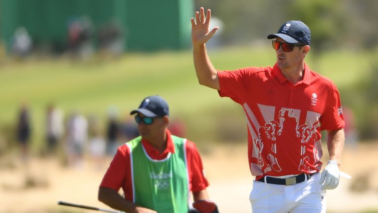 Britain's Justin Rose reacts after an Eagle on hole 3 competes in the men's individual stroke play at the Olympic Golf course during the Rio 2016 Olympic G