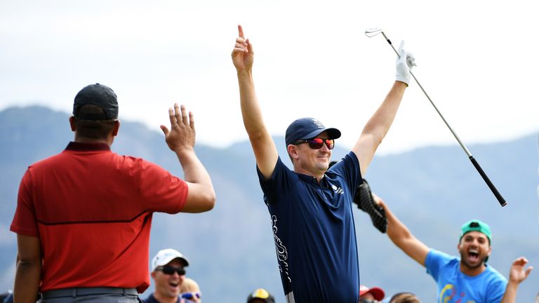 RIO DE JANEIRO, BRAZIL - AUGUST 11:  Justin Rose of Great Britain celebrates with Jhonattan Vegas of Venezuela after hitting a hole in one on the fourth ho