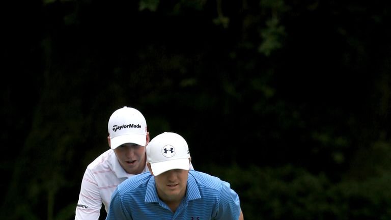 PONTE VEDRA BEACH, FL - MAY 05:  Justin Thomas, Jordan Spieth, and Daniel Berger look over a shot during a practice round for THE PLAYERS Championship at t