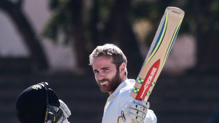 New Zealand captain Kane Williamson lifts his bat in celebration of his century during day two of second Test against Zimbabwe