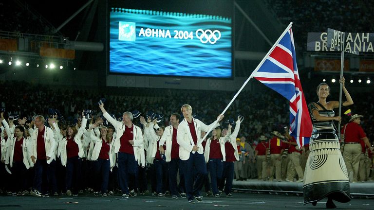 Flag bearer Kate Howey leads the delegation from Great Britain as they walk during the parade of nations at the 2004 Athens Olympics opening ceremony 