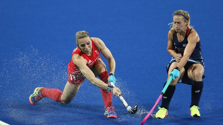 RIO DE JANEIRO, BRAZIL - AUGUST 13:  Kate Richardson-Walsh of Great Britain plays the ball past Katie Bam during the Women's group B hockey match between G