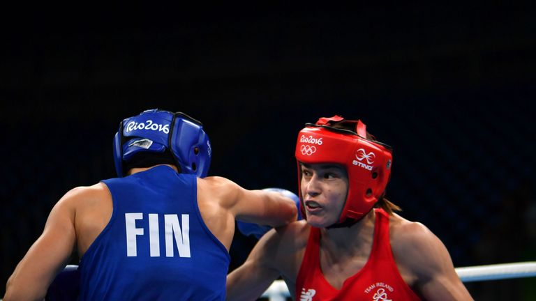 Ireland's Katie Taylor (R) fights Finland's Mira Potkonen during the Women's Light (57-60kg) Quarterfinal 1 match at the Rio 2016 Olympic Games at the Rioc