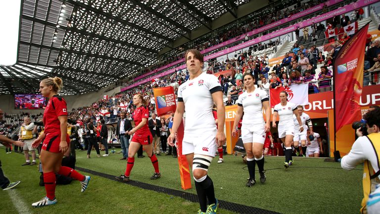 England Captain Katy Mclean leads the team out ahead of the IRB Women's Rugby World Cup 2014 Final between England and Canada