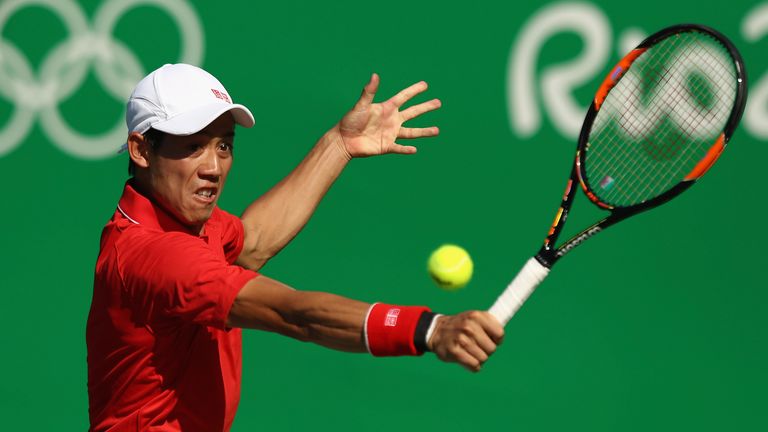 RIO DE JANEIRO, BRAZIL - AUGUST 14:  Kei Nishikori of Japan makes return during the singles bronze medal match against Rafael Nadal of Spain on Day 9 of th