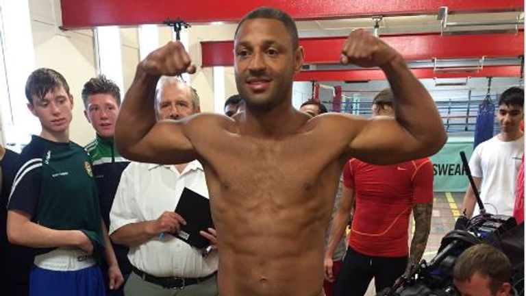 Kell Brook flexes his muscles after weighing in at 176lbs