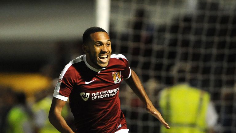 Northampton's Kenji Gorre celebrates after scoring the winning penalty against West Brom