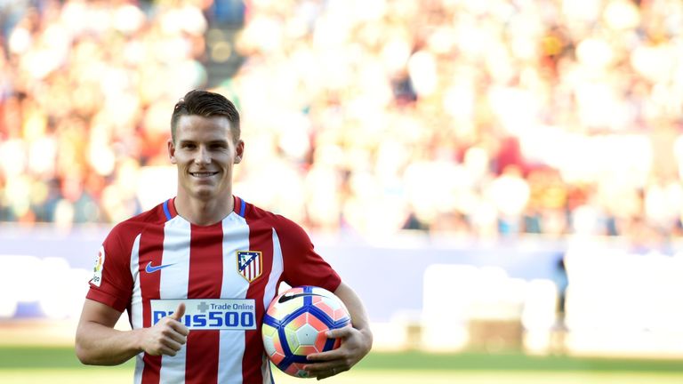 Atletico Madrid's new signing Kevin Gameiro poses with a ball during his presentation at the Vicente Calderon stadium in Madrid on July 3 2016