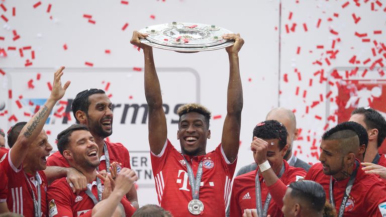 MUNICH, GERMANY - MAY 14: Kingsley Coman of Muenchen lifts the Meisterschale as players and staffs celebrate the Bundesliga championship after the Bundesli