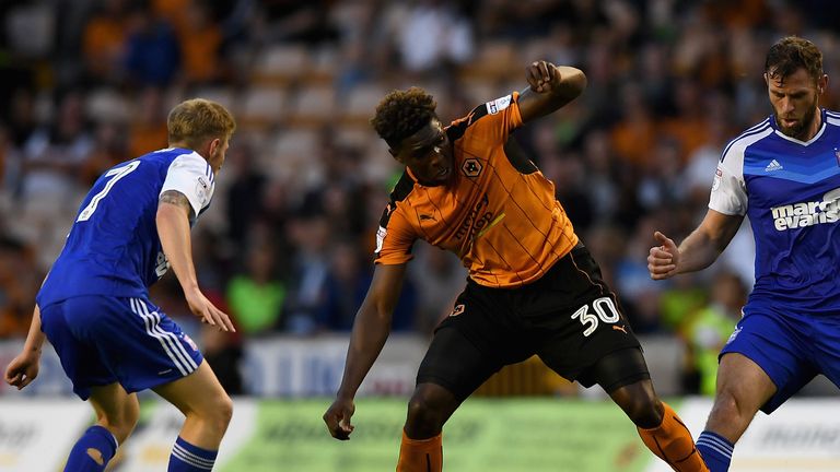 Kortney Hause of Wolves is tackled by Daryl Murphy and Teddy Bishop