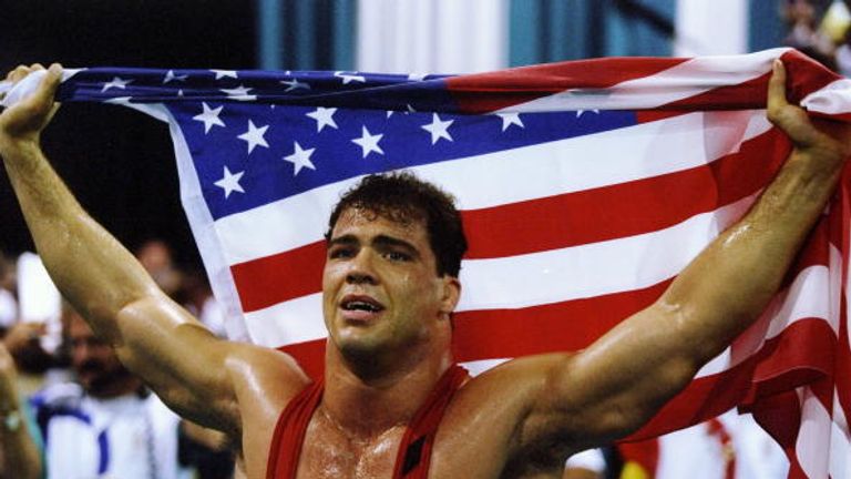 31 Jul 1996: Kurt Angle of the United States holds the American flag at the free-style wrestling competition during the Summer Olympics at the Georgia Worl