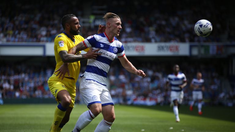 Kyle Bartley of Leeds United and Sebastian Polter of QPR challenge for the ball during the Sky Bet Championship match 