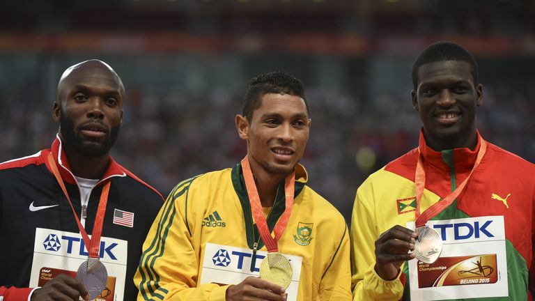 (L-R) USA's silver medallist LaShawn Merritt, South Africa's gold medallist Wayde van Niekerk and Grenada's bronze medallist Kirani James pose with their m