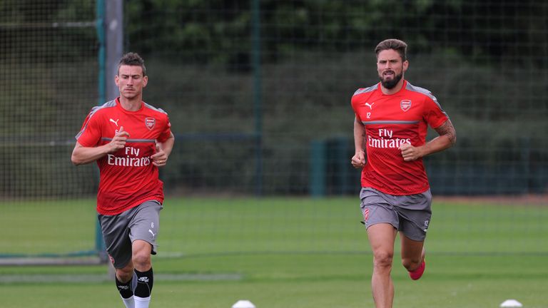 Laurent Koscielny (left) and Olivier Giroud return to pre-season training with Arsenal