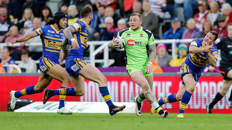 Josh Charnley of Wigan Warriors.Danny McGuire (right), Ashton Golding (left) and Zak Hardaker of Leeds Rhinos