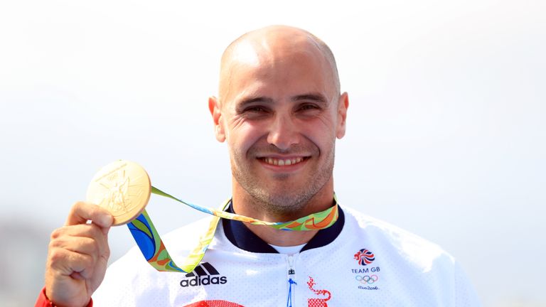 Great Britain's Liam Heath displays his gold medal in the men's K1 200 metres on the fifteenth day of the Rio Olympics Games, Brazil.