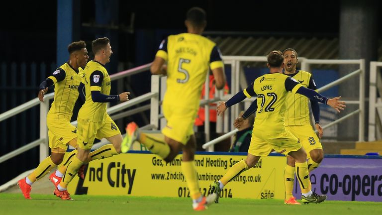Oxford United's Liam Sercombe (back right) celebrates scoring his side's first goal of the game against Birmingham City in the EFL Cup