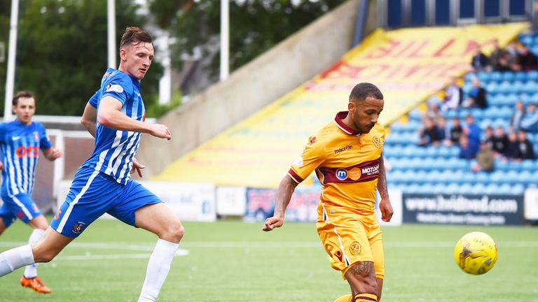 Motherwell's Lionel Ainsworth lofts the ball into the Kilmarnock net