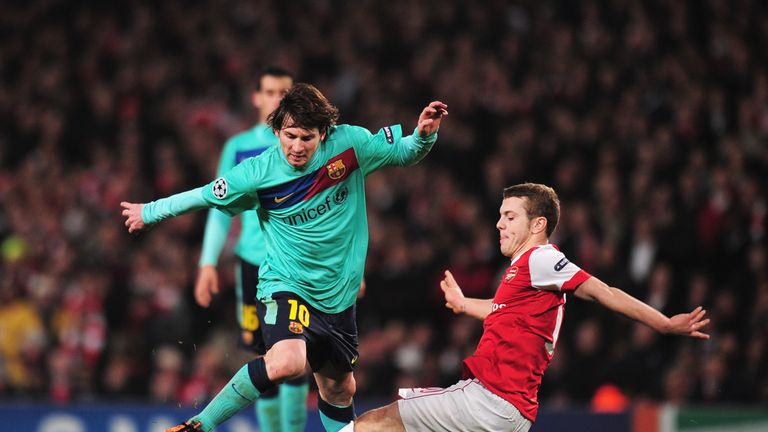 FEBRUARY 16 2011: Lionel Messi of Barcelona is challenged by Jack Wilshere of Arsenal during the UEFA Champions League round of 16 first leg