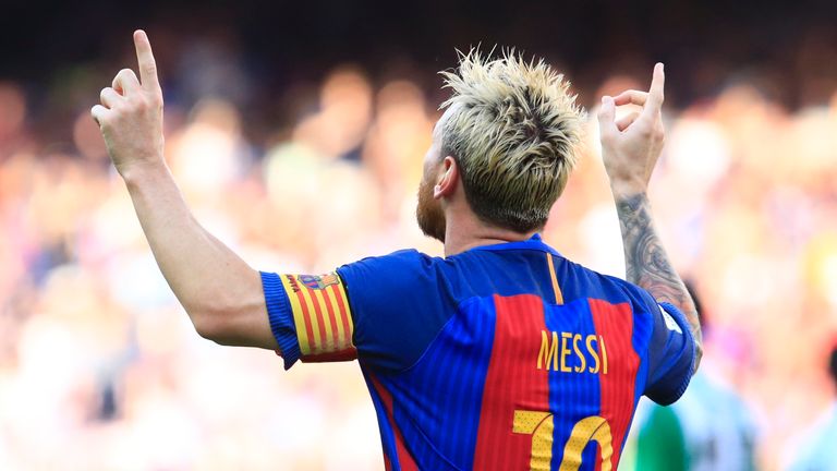 Lionel Messi celebrates after his goal against Real Betis