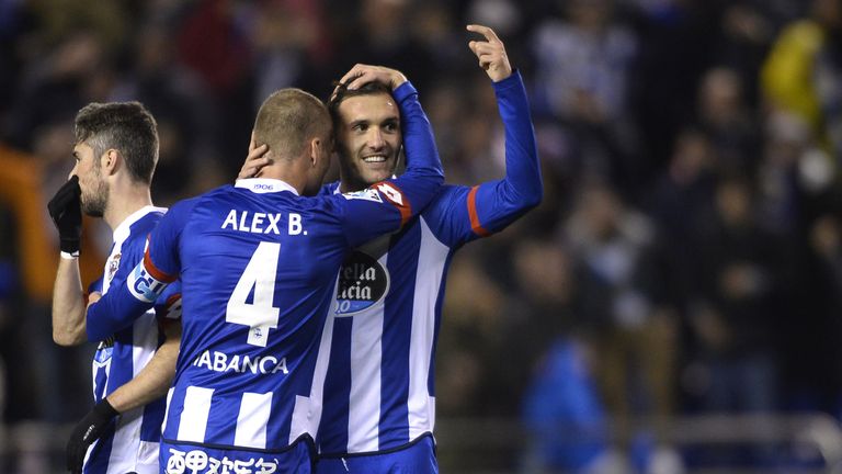 Lucas Perez (R) hugs his Deportivo team-mate Alex Bergantinos after scoring their second goal