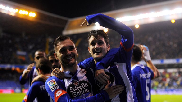Deportivo La Coruna's midfielder Luis Alberto (R) celebrates with teammate midfielder Lucas Perez after scoring a goal during the Spanish league football m