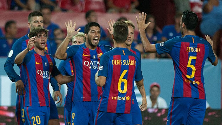Barcelona's Uruguayan forward Luis alberto Suarez (C) celebrates with his teammates after scoring during the first leg of the