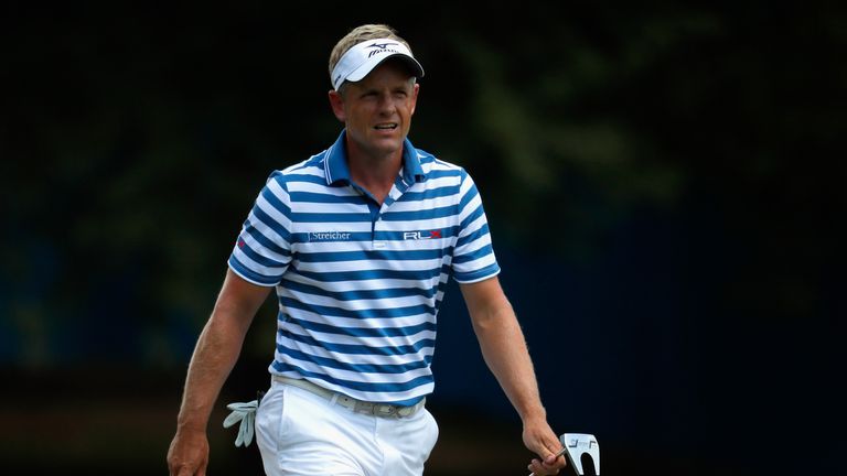 GREENSBORO, NC - AUGUST 20:  Luke Donald walks up the first hole during the third round of the Wyndham Championship at Sedgefield Country Club on August 20