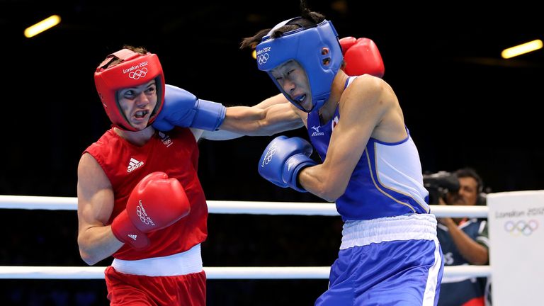 Luke Campbell (L) of Great Britain competes against Satoshi Shimizu of Japan during their Men's Bantam (56kg) Boxing Semifina