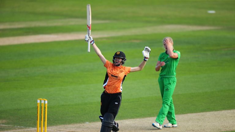 Lydia Greenway celebrates hitting the winning runs for Southern Vipers