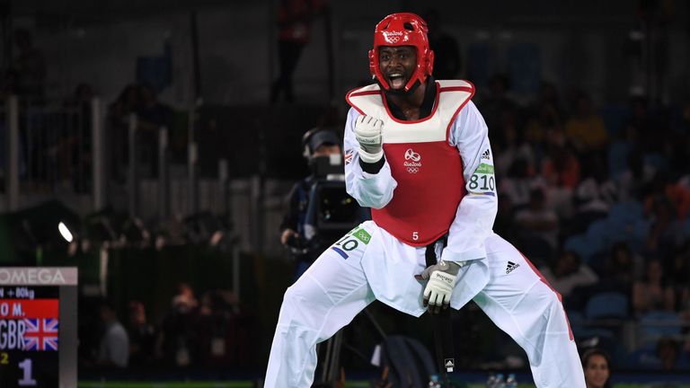 Mahama Cho celebrates his quarter-final win but it would be a tough end for the British fighter