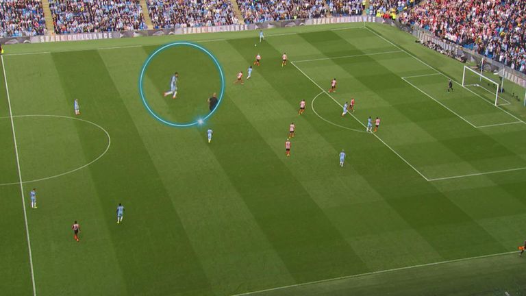 After passing the ball out to the left flank, Gael Clichy turns his head infield to check on City's defensive positioning