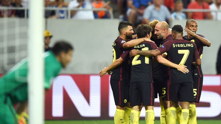 Nolito celebrates with teammates after scoring Manchester City's third