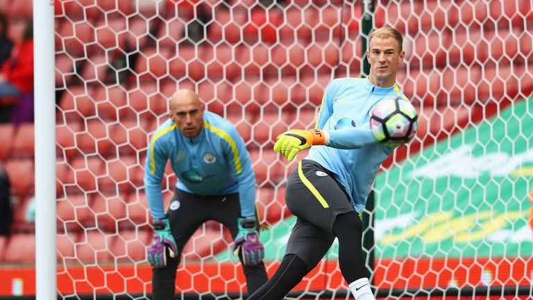 Joe Hart (R) warms up with team-mate Willy Caballero