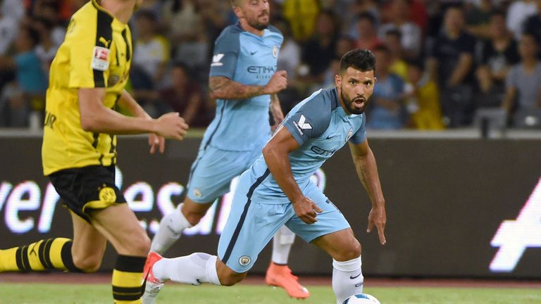 Manchester City's Sergio Aguero (R) controls the ball during the 2016 International Champions Cup football match between Manchester City and Borussia Dortm