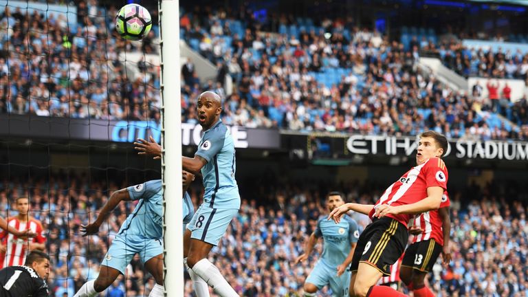 Paddy McNair of Sunderland scores a own goal for Manchester City's second goal 