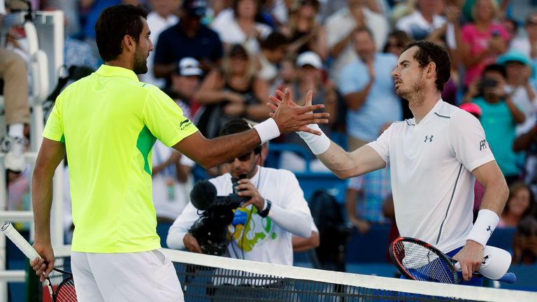 Marin Cilic is congratulated by Andy Murray