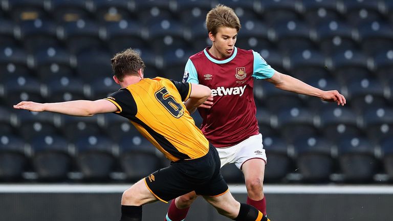 Ben Clappison of Hull tackles Martin Samuelsen of West Ham during the Second Leg of the Premier League U21 Cup Final at the KC Sta