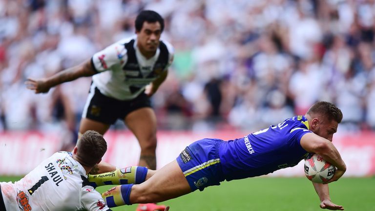 Matty Russell of Warrington Wolves scores his teams opening try