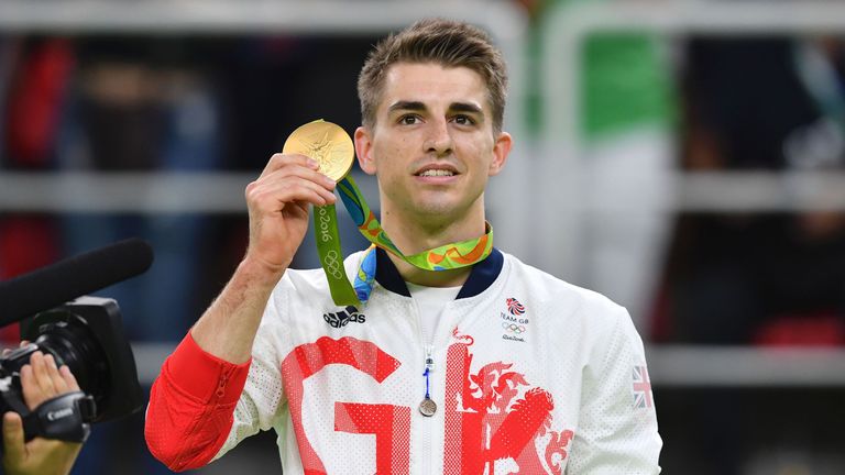 Britain's Max Whitlock celebrates with his gold medal 