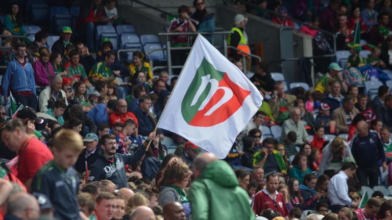 Mayo supporter Mark Togher (holding flag) predicts a six point win on Sunday