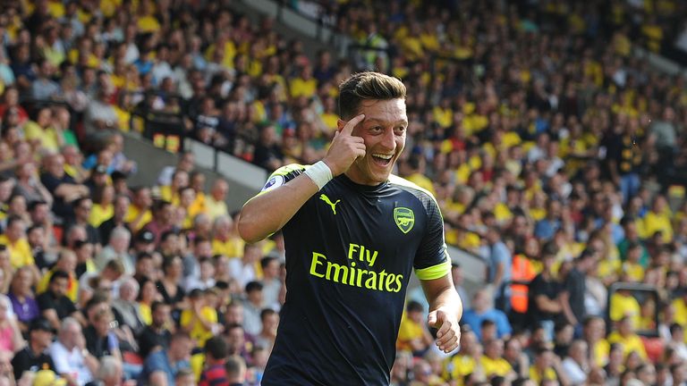 Mesut Ozil celebrates his goal for Arsenal in the Premier League match at Watford