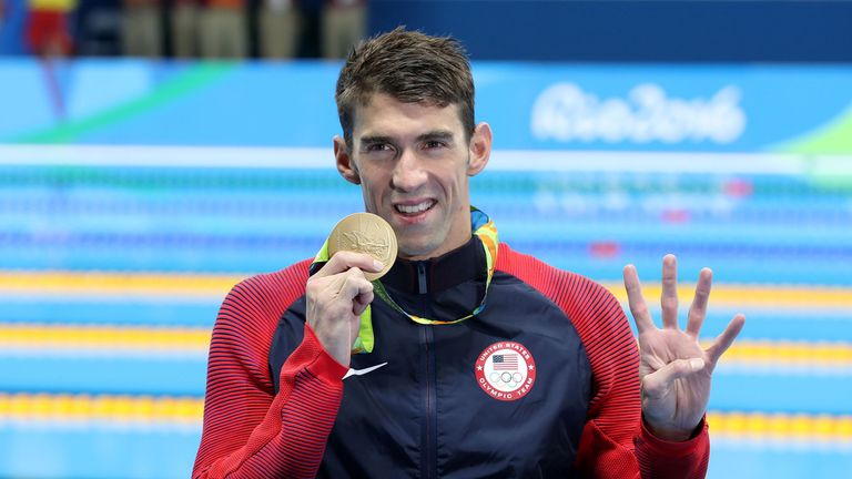 Michael Phelps celebrates winning another gold medal in the men's individual medley
