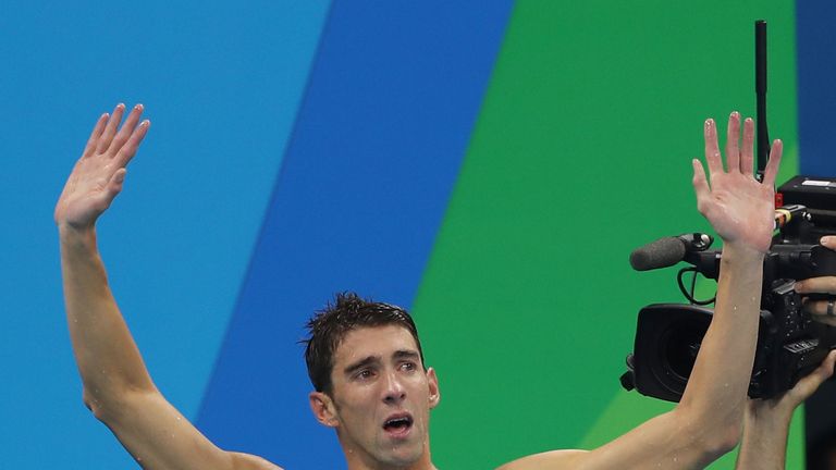 USA's Michael Phelps celebrates after his team wins the men's 4 x 100m medley relay final